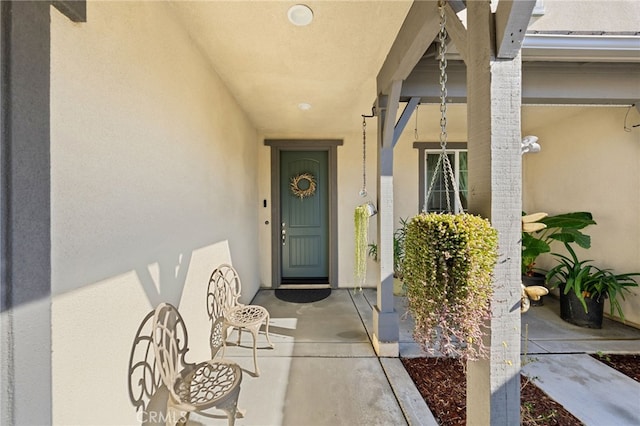 32084 Richardson St, Menifee, CA 92584 - view of exterior entry featuring stucco siding and covered porch