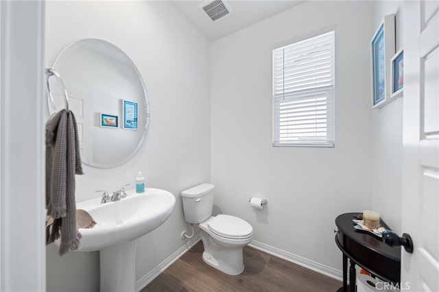 32084 Richardson St, Menifee, CA 92584 - half bathroom featuring toilet and wood finished floors