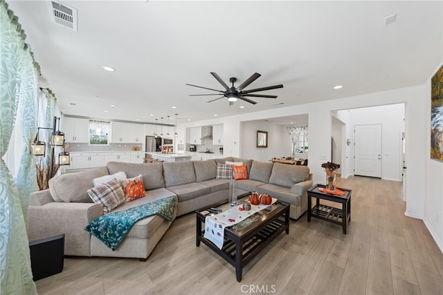32084 Richardson St, Menifee, CA 92584 - living area with light wood-style flooring, a ceiling fan, and recessed lighting