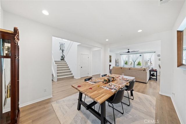 32084 Richardson St, Menifee, CA 92584 - dining room with stairway, light wood-style flooring, a ceiling fan, and recessed lighting