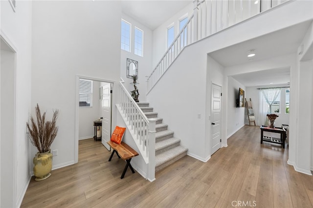 32084 Richardson St, Menifee, CA 92584 - foyer entrance featuring stairs, light wood finished floors, and a high ceiling