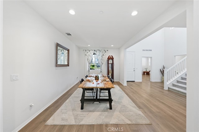 32084 Richardson St, Menifee, CA 92584 - dining area featuring stairs, wood finished floors, and recessed lighting