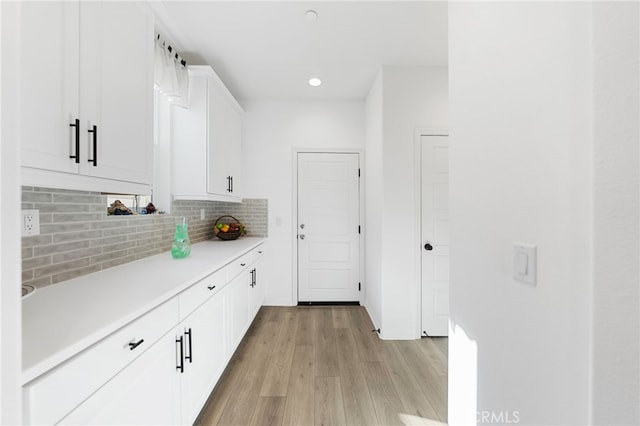 32084 Richardson St, Menifee, CA 92584 - kitchen featuring light wood-type flooring, backsplash, light countertops, white cabinetry, and recessed lighting