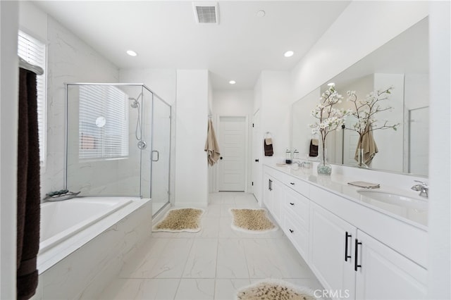 32084 Richardson St, Menifee, CA 92584 - full bathroom with marble look tile flooring, double vanity, a bath, a stall shower, and recessed lighting