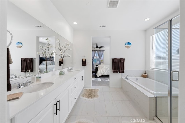 32084 Richardson St, Menifee, CA 92584 - ensuite bathroom with marble look tiles, a bath, double vanity, a ceiling fan, and recessed lighting