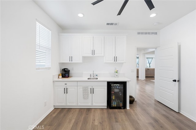 32084 Richardson St, Menifee, CA 92584 - indoor wet bar with wine cooler, a ceiling fan, wood finished floors, and recessed lighting