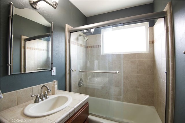 45011 16th St W, Lancaster, CA 93534 - bathroom featuring vanity and shower / bath combination with glass door
