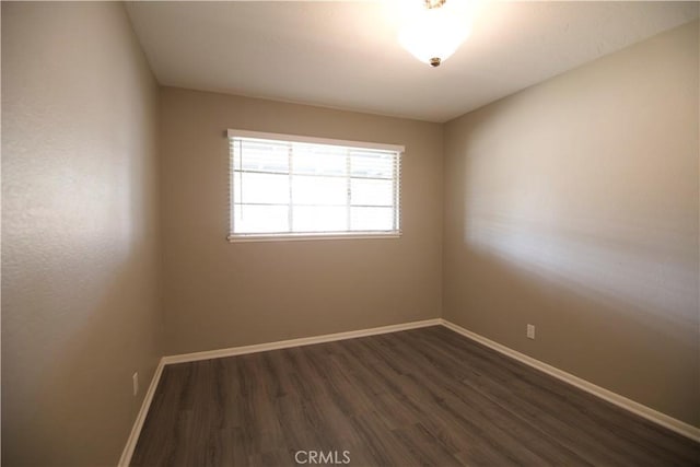 45011 16th St W, Lancaster, CA 93534 - empty room with dark wood-style flooring and baseboards