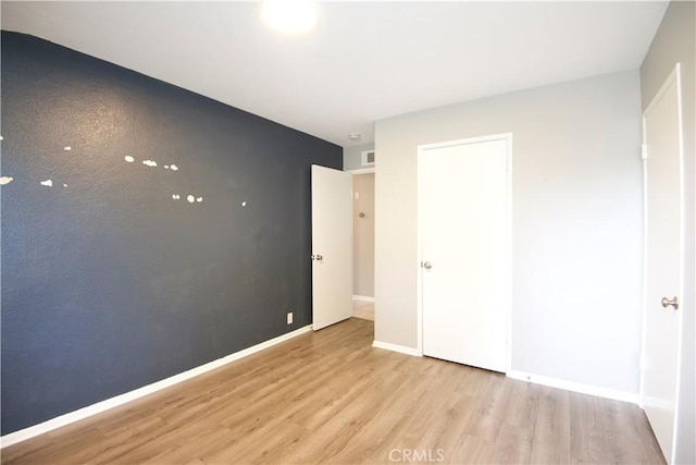 45011 16th St W, Lancaster, CA 93534 - unfurnished bedroom with wood finished floors and baseboards