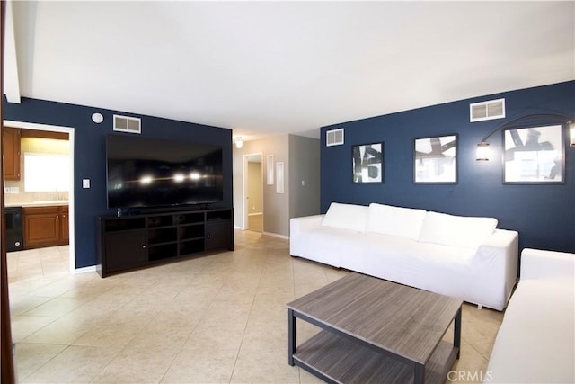 45011 16th St W, Lancaster, CA 93534 - living room featuring light tile patterned floors and baseboards