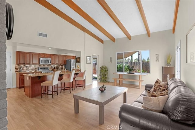 12674 Metate Ln, Poway, CA 92064 - living area with high vaulted ceiling, beamed ceiling, and light wood-type flooring