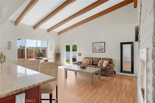 12674 Metate Ln, Poway, CA 92064 - living area with french doors, beamed ceiling, light wood finished floors, and high vaulted ceiling