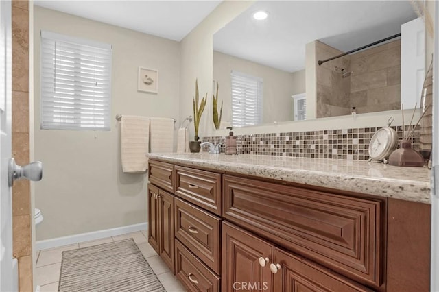12674 Metate Ln, Poway, CA 92064 - full bathroom with double vanity, backsplash, tile patterned flooring, and a shower