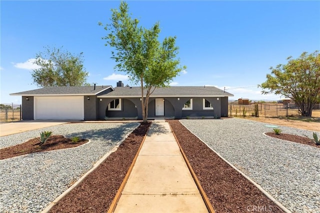11343 1st Ave, Hesperia, CA 92345 - ranch-style home featuring driveway, an attached garage, and stucco siding