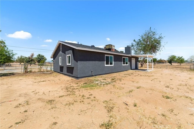11343 1st Ave, Hesperia, CA 92345 - back of property featuring stucco siding and a chimney