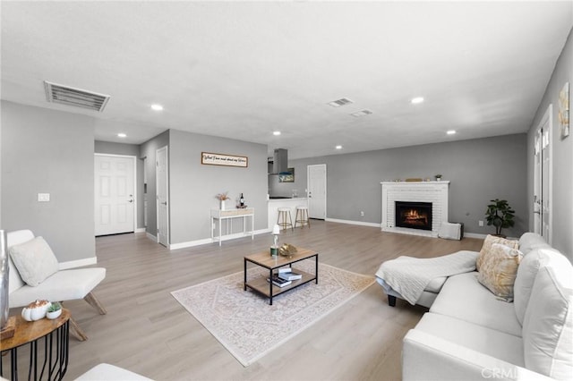 11343 1st Ave, Hesperia, CA 92345 - living area with wood finished floors, recessed lighting, and a brick fireplace