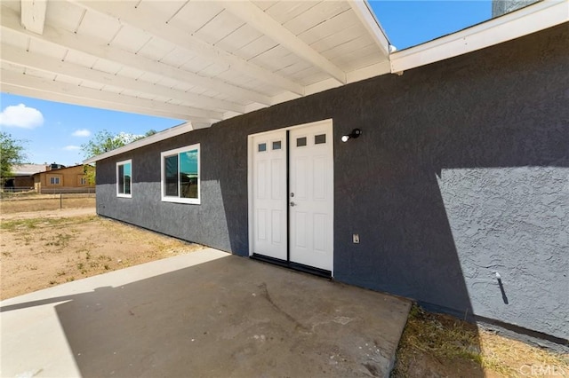 11343 1st Ave, Hesperia, CA 92345 - view of exterior entry with a patio area and stucco siding