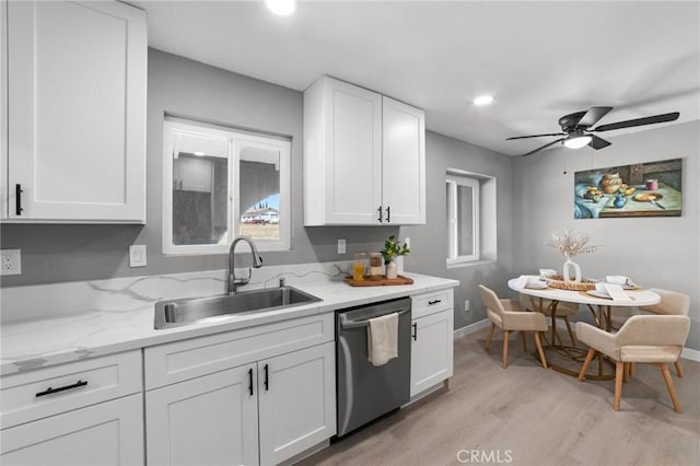 11343 1st Ave, Hesperia, CA 92345 - kitchen with stainless steel dishwasher, light wood-type flooring, white cabinets, ceiling fan, and light stone countertops