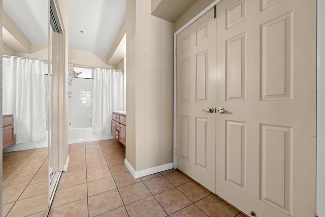 640 Camino De La Reina Unit 1108, San Diego, CA 92108 - full bath with vanity, tile patterned flooring, and shower / bath combo with shower curtain
