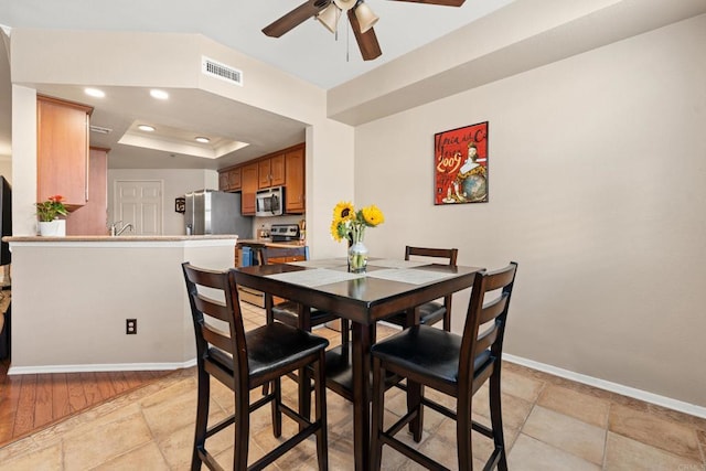 640 Camino De La Reina Unit 1108, San Diego, CA 92108 - dining area featuring ceiling fan, a raised ceiling, and recessed lighting