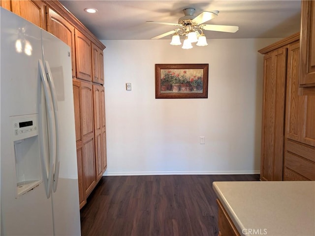5499 Paseo Del Lago W Unit 3D, Laguna Woods, CA 92637 - kitchen featuring white fridge with ice dispenser, ceiling fan, dark wood-type flooring, recessed lighting, and brown cabinets