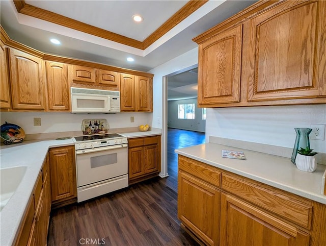 5499 Paseo Del Lago W Unit 3D, Laguna Woods, CA 92637 - kitchen with white appliances, dark wood finished floors, recessed lighting, light countertops, and a raised ceiling
