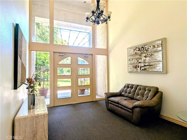 5499 Paseo Del Lago W Unit 3D, Laguna Woods, CA 92637 - foyer featuring carpet flooring, a chandelier, and a towering ceiling