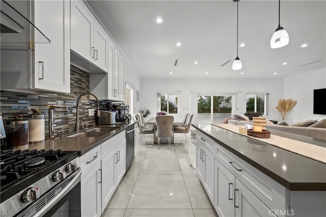 11209 Forbes Ave, Granada Hills, CA 91344 - kitchen featuring dark countertops, open floor plan, backsplash, stainless steel appliances, and recessed lighting