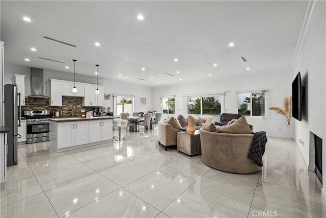 11209 Forbes Ave, Granada Hills, CA 91344 - living area with crown molding and recessed lighting