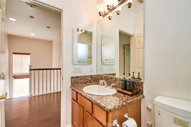 717 Arcadia Ave Unit C, Arcadia, CA 91007 - half bathroom with vanity, wood finished floors, and recessed lighting