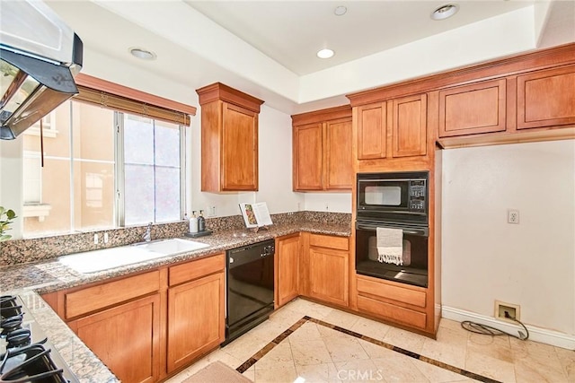 717 Arcadia Ave Unit C, Arcadia, CA 91007 - kitchen featuring black appliances, light stone countertops, brown cabinets, recessed lighting, and inlaid floor details