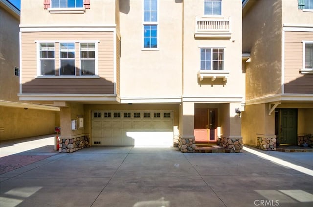 717 Arcadia Ave Unit C, Arcadia, CA 91007 - back of property with stucco siding, driveway, and an attached garage