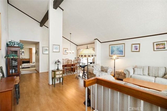 23484 Coyote Springs Dr, Diamond Bar, CA 91765 - living area featuring vaulted ceiling, wood finished floors, and a chandelier