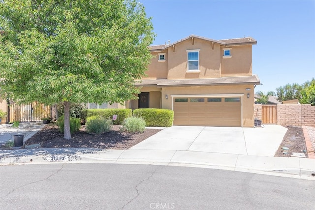 31572 Via Del Paso, Winchester, CA 92596 - view of front of home with a garage, driveway, stucco siding, and a tiled roof