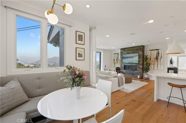 35481/2 Multiview Dr, Los Angeles, CA 90068 - dining space featuring light wood-style floors, a stone fireplace, and recessed lighting