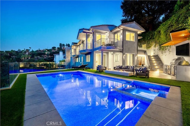 35481/2 Multiview Dr, Los Angeles, CA 90068 - view of pool featuring an outdoor hangout area, an outdoor kitchen, a pool with connected hot tub, a patio, and a lawn
