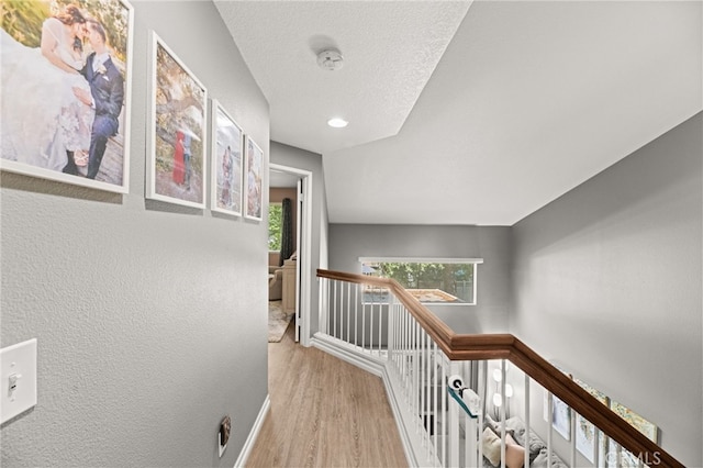 3732 Calle Monada, Riverside, CA 92503 - corridor featuring an upstairs landing, wood finished floors, recessed lighting, and a textured wall