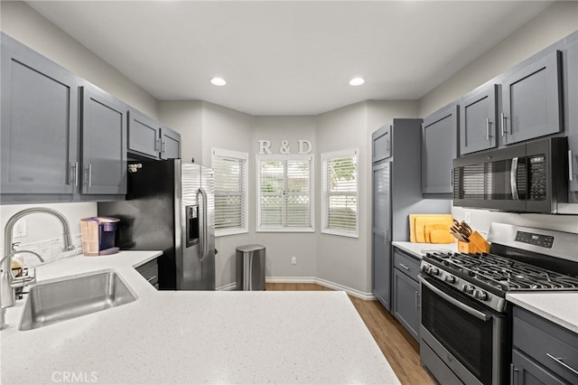3732 Calle Monada, Riverside, CA 92503 - kitchen with stainless steel appliances, gray cabinetry, recessed lighting, and wood finished floors