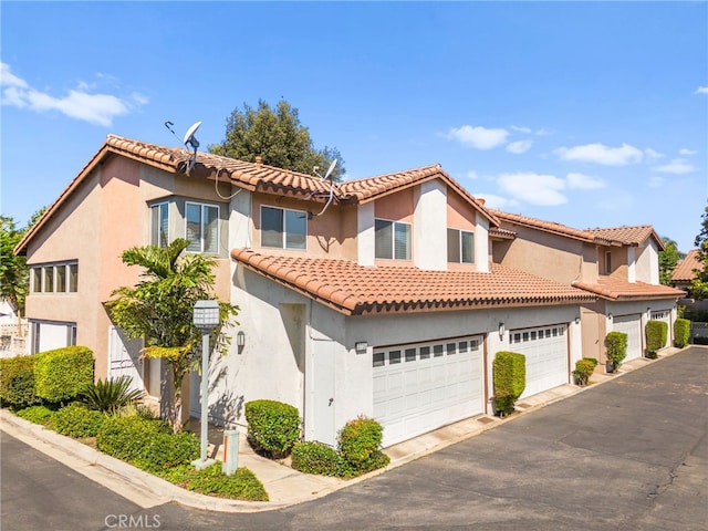 3732 Calle Monada, Riverside, CA 92503 - mediterranean / spanish home with stucco siding, driveway, a tile roof, and an attached garage