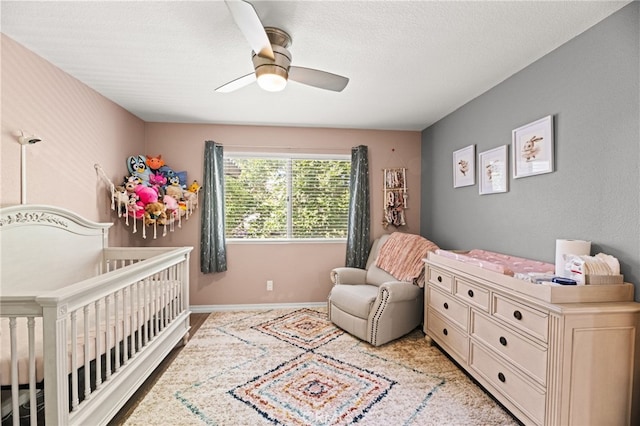 3732 Calle Monada, Riverside, CA 92503 - bedroom with a nursery area, a ceiling fan, and a textured ceiling