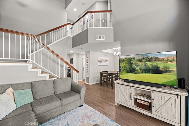 3732 Calle Monada, Riverside, CA 92503 - living area featuring stairway, wood finished floors, a towering ceiling, recessed lighting, and a chandelier