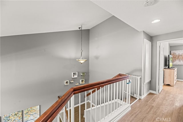 3732 Calle Monada, Riverside, CA 92503 - hall with an upstairs landing, wood finished floors, and vaulted ceiling
