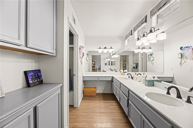 3732 Calle Monada, Riverside, CA 92503 - bathroom featuring double vanity and wood finished floors
