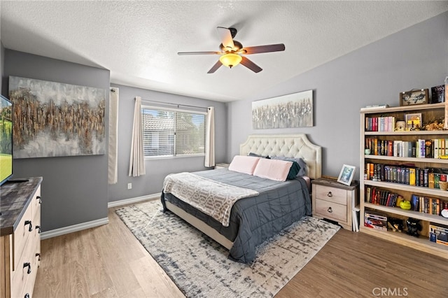3732 Calle Monada, Riverside, CA 92503 - bedroom featuring light wood-style floors, a textured ceiling, lofted ceiling, and a ceiling fan