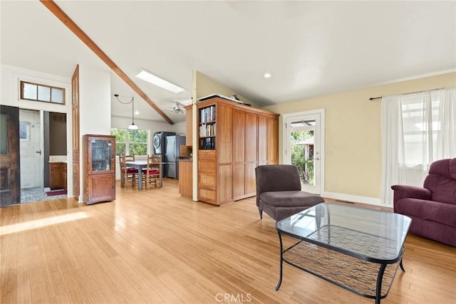10 Roseanna Ct, Chico, CA 95973 - living room with light wood-type flooring, plenty of natural light, high vaulted ceiling, and a skylight