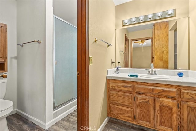 10 Roseanna Ct, Chico, CA 95973 - bathroom with wood finished floors, a stall shower, and vanity