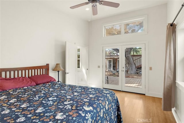 10 Roseanna Ct, Chico, CA 95973 - bedroom featuring access to exterior, wood finished floors, a high ceiling, and a ceiling fan
