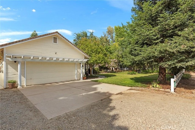 10 Roseanna Ct, Chico, CA 95973 - view of side of home with a yard and a detached garage