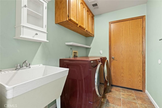 10 Roseanna Ct, Chico, CA 95973 - laundry area featuring cabinet space, independent washer and dryer, and stone finish floors