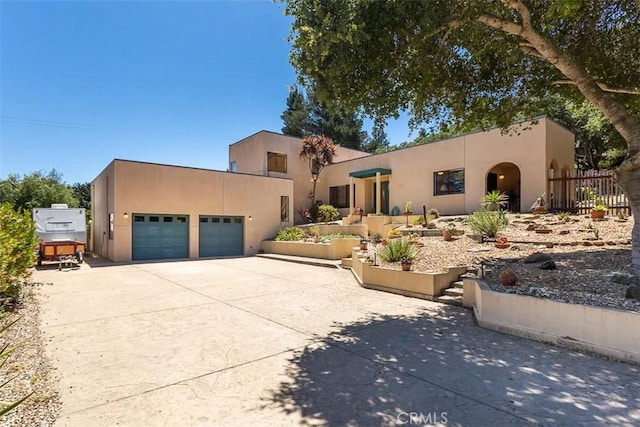 1410 Verde Canyon Rd, Arroyo Grande, CA 93420 - view of front of home featuring an attached garage, stucco siding, and driveway